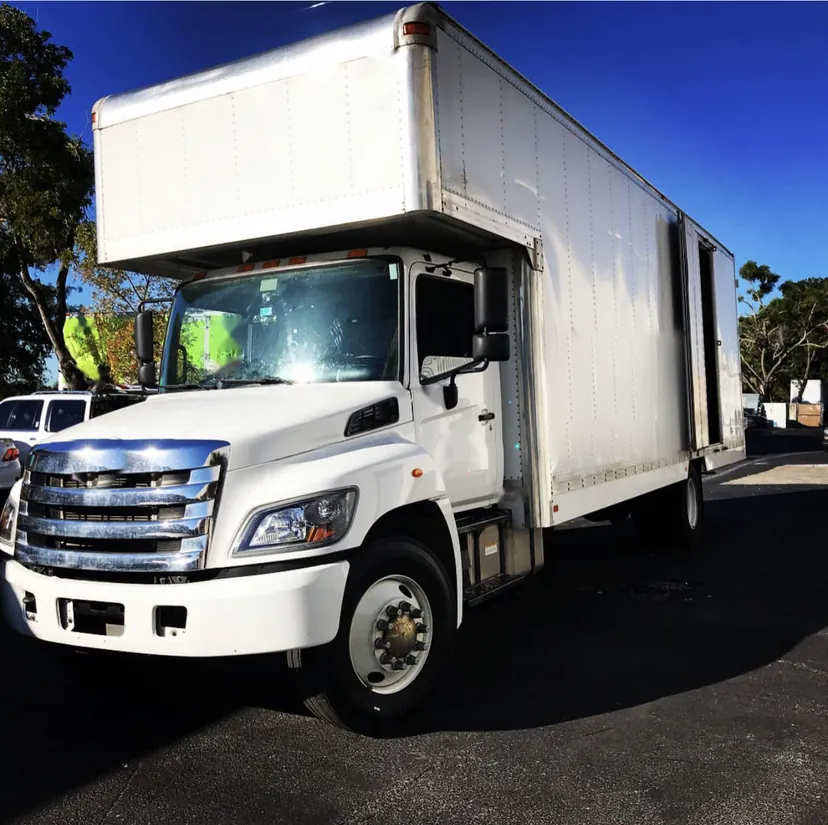 A white box truck from my previous moving job, before One Piece Delivery.